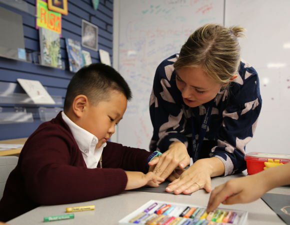 Teacher helping a student